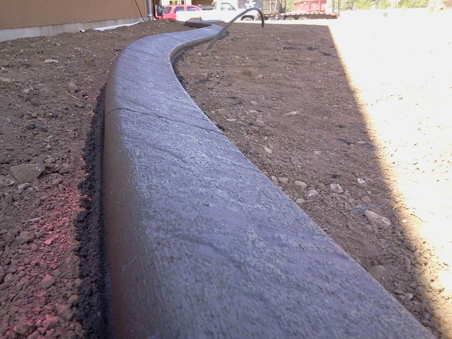 Concrete landscape curbing installed at a home in Benson, Utah