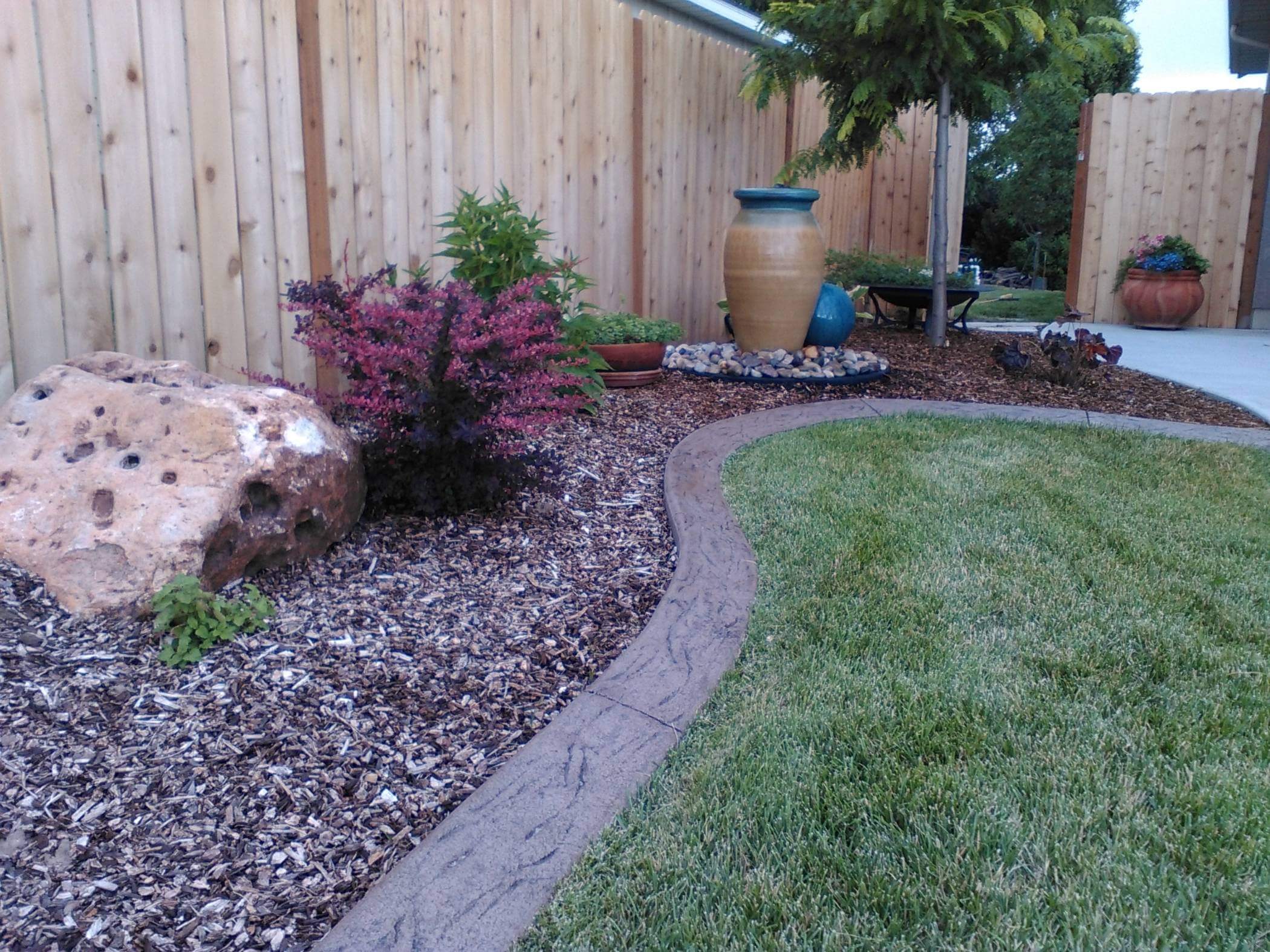 Stained and stamped decorative concrete curbing in Logan, Utah